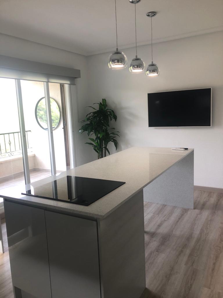 Homefix project kitchen renovation in Alicante with large island installation