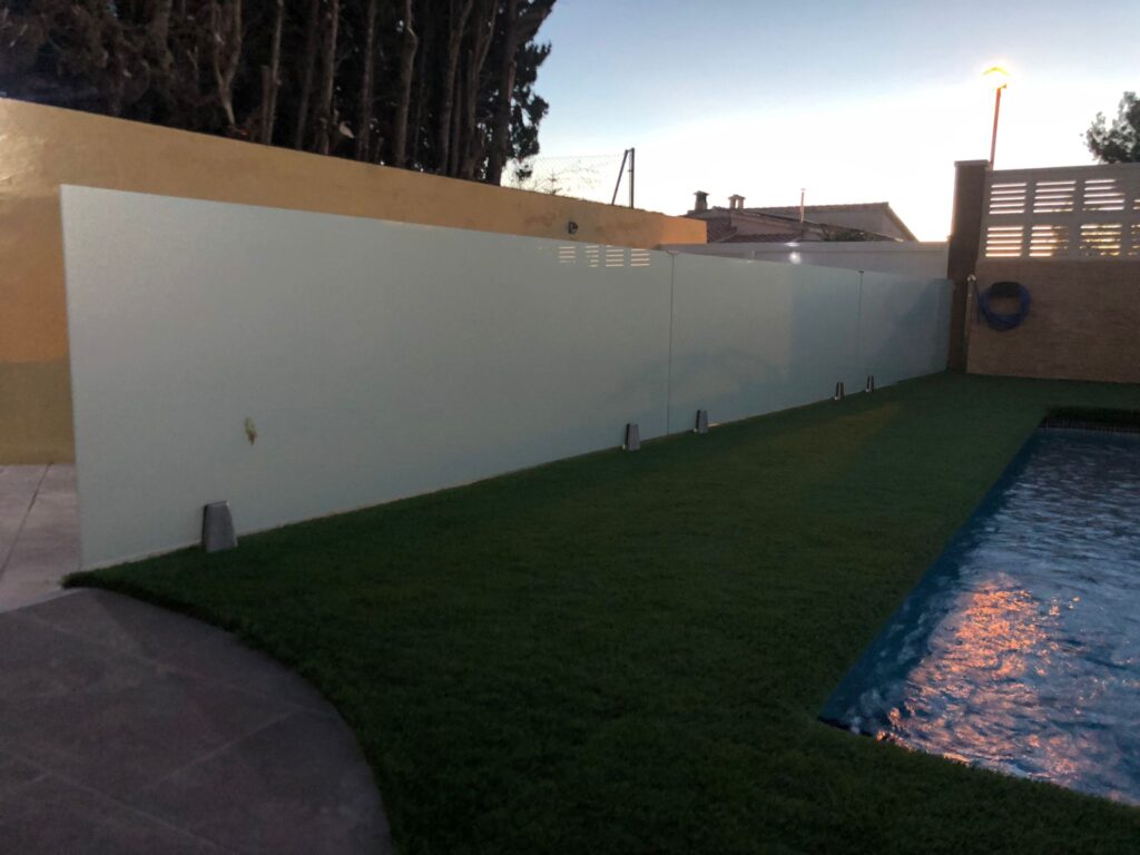 Glass fence installation and garden and pool space design
