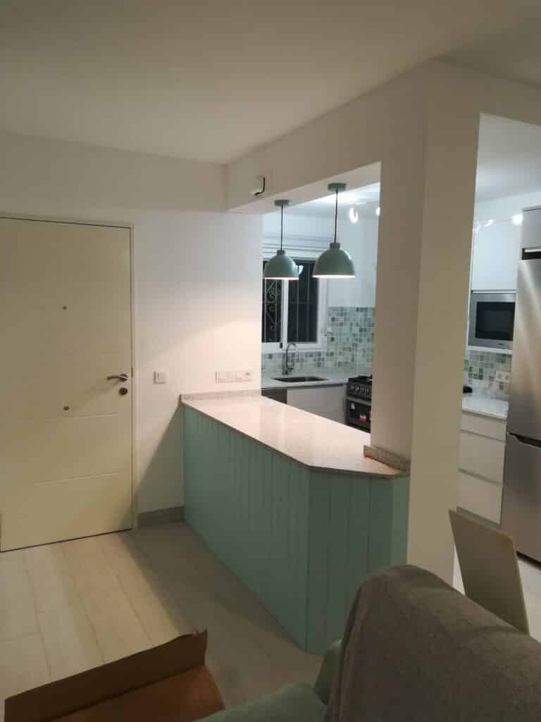 Coastal Kitchen renovation in Spain with hidden doors solution