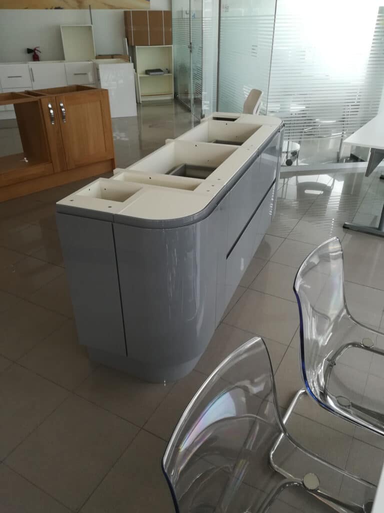 Curved grey kitchen island and dining room modern chairs